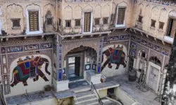Mandawa, India - Dec 29, 2019: Colorful painted Haveli in the city of Mandawa, Rajasthan, India. The streets of Mandawa are famous for the colorful painting on Haveli's walls.