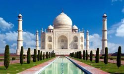 Taj mahal on a bright day in Agra, India - A monument of love in clear blue sky